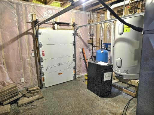 Additional storage under garage is easily accessible through the side sliding door in basement.