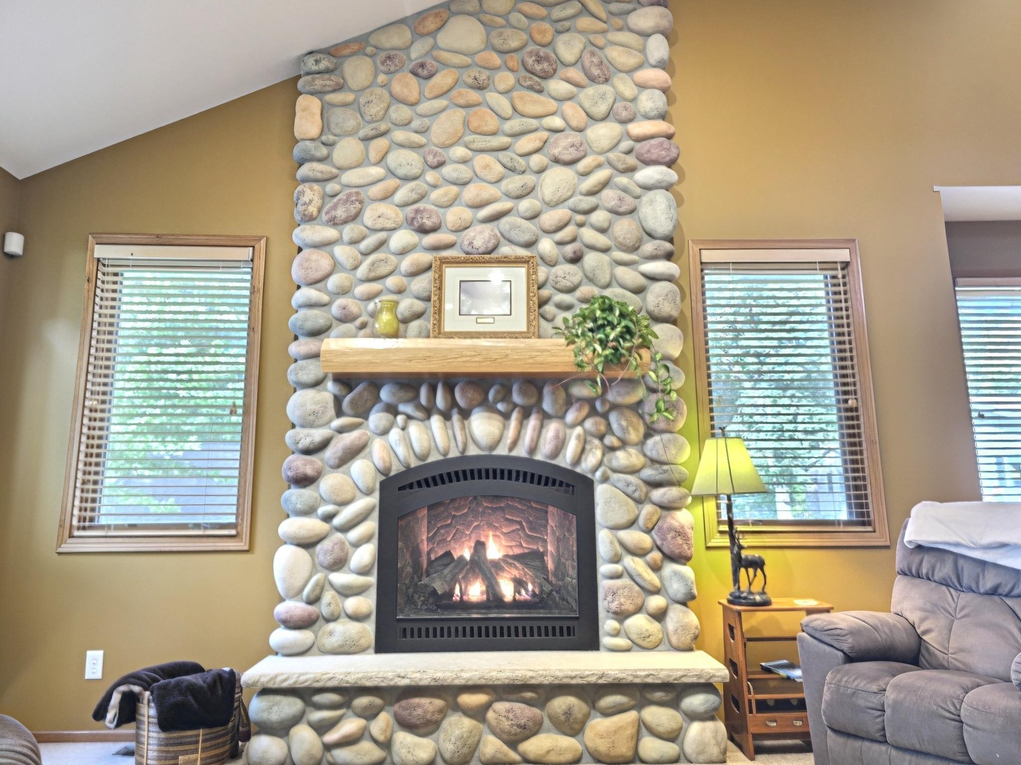 Warm up this fall around this stunning stone hearth gas fireplace. The perfect place to gather with friends and family creating lasting memories.