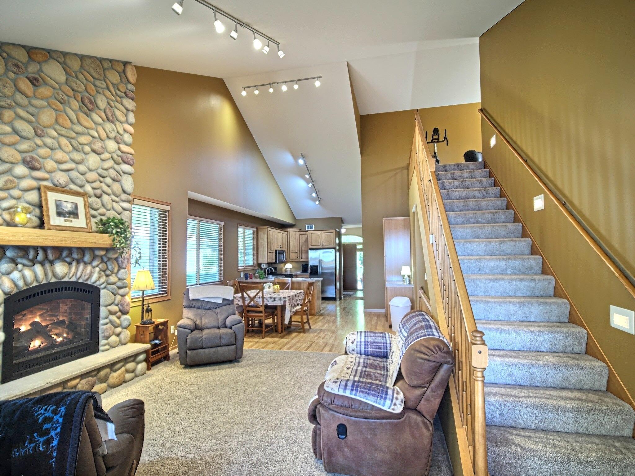 The stunning stone fireplace serves as the heart of the home, offering warmth, character, and the perfect place to gather.