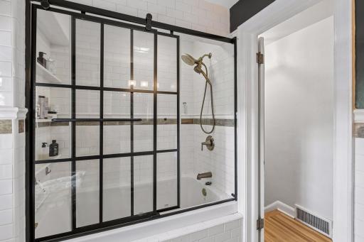Gorgeous shower and tile in upper level full bath.