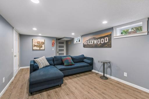 Lower level family room is a spacious room for entertaining or movie nights!