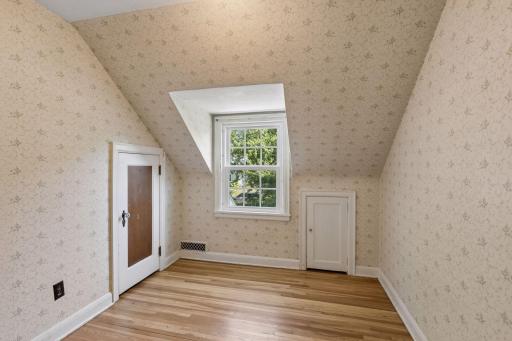Upper level 4th bedroom has hardwood floors and adorable closets with tons of character.
