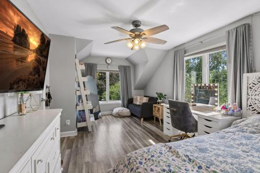 Upper level main bedroom has a sitting area and 3 large windows facing the front, side and back of the house.