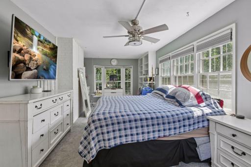 Main floor bedroom could also be used as a bonus room or sun room! New light fixture/fan just added 2026.