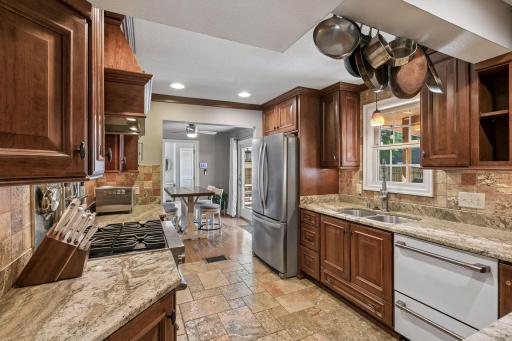 Kitchen has tiled floors, high end appliances and granite countertops. Move in and enjoy!