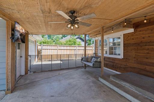 Spacious covered patio area adds convenience of electrical for enjoying time outside in the summer and fall.