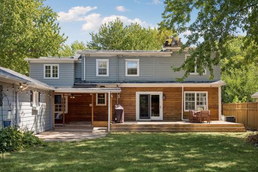Step outside to enjoy the expansive deck and inviting outdoor seating area—perfect for entertaining, relaxing, or enjoying the spacious backyard. New roof 2024.