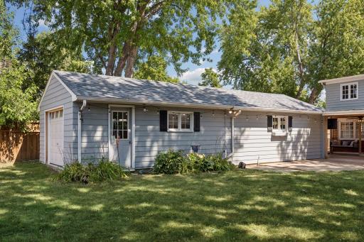The three-car tandem garage offers exceptional storage and parking options.