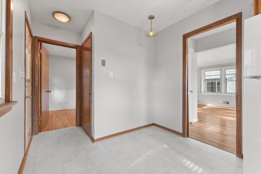 Dining nook with simple access between the kitchen and main living areas.