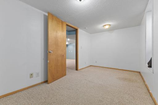 Additional lower-level room offering privacy and everyday flexibility.