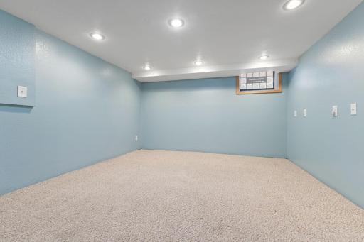 Lower-level bonus area with recessed lighting and a comfortable open feel.