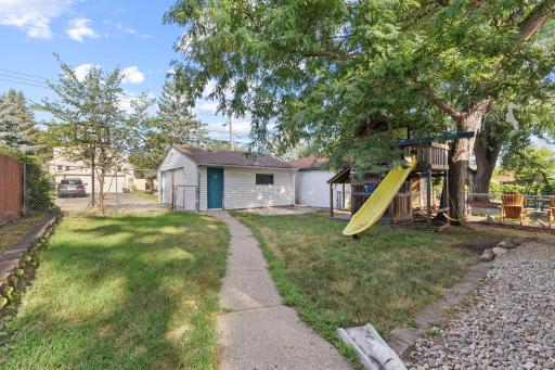 Backyard path leading to the garage and outdoor space.