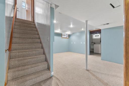 Finished lower-level space with room for media, recreation, or a home office setup.