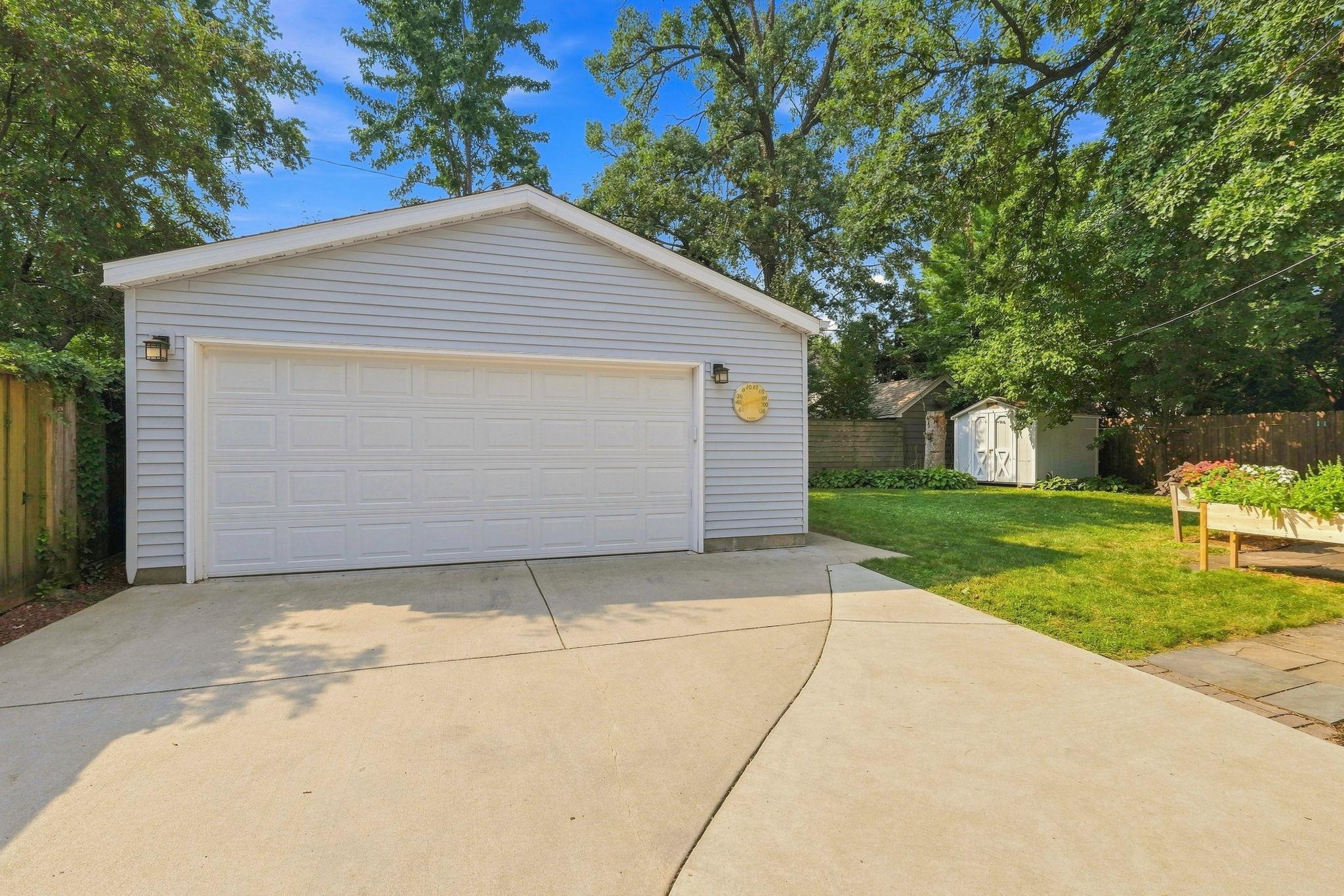 the newer concrete welcomes you to this oversized car garage.