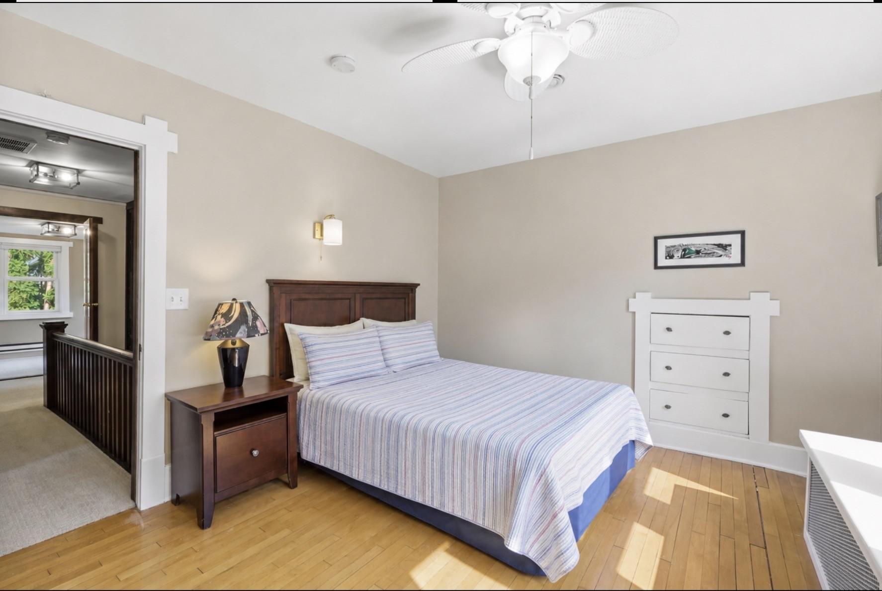 This bedroom offers great space and a built-in dresser.