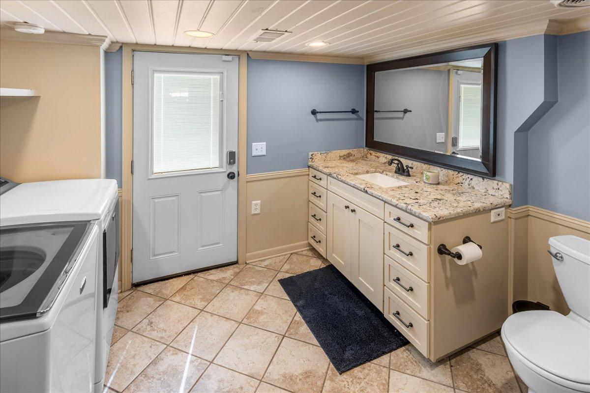 Lower level 3/4 bathroom and laundry area.