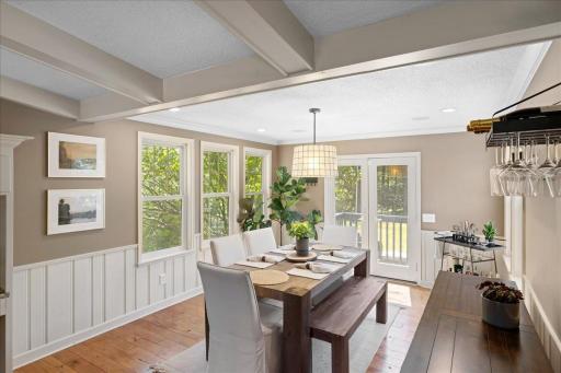 Sunny dining room area with easy access to the backyard through the double doors.