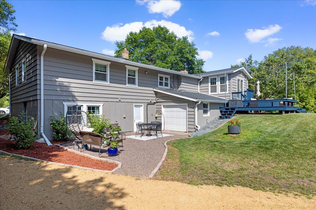 Another view of the patio area and 3rd garage bay on the backside of the home.