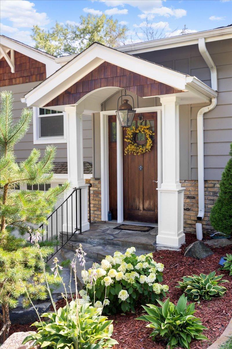 Charming covered front entry area to greet your guests.