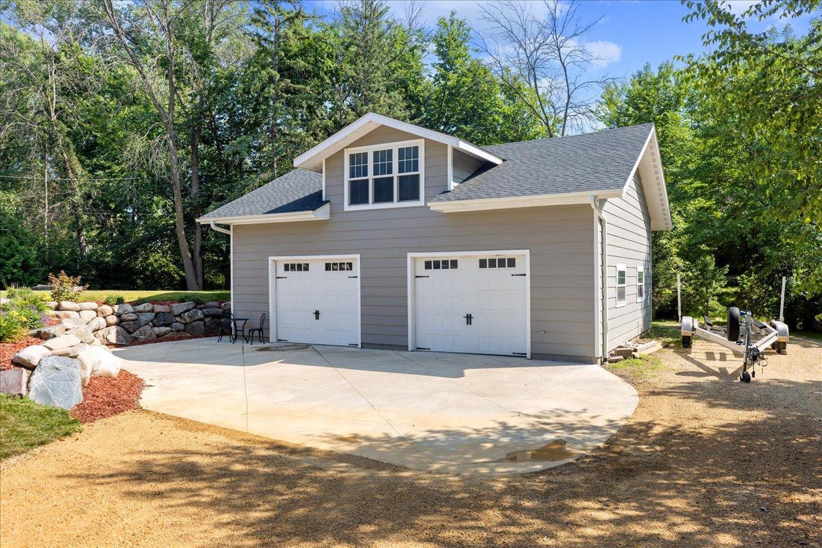 Amazing detached garage with finished loft is the perfect space for toy management!