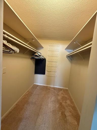 Owners Suite walk-in closets with double shelving and ready to hang up your clothes. Shoe organizer included