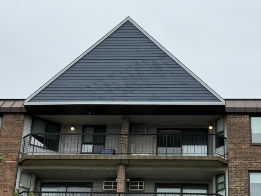View from lower courtyard culdesac of the 5th floor covered double balcony