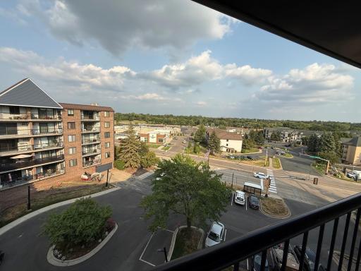 5th floor balcony view of Saint Anthony Shopping Center short walk across stree to use a bank , library, restaurants,bus, Dairy queen, etc