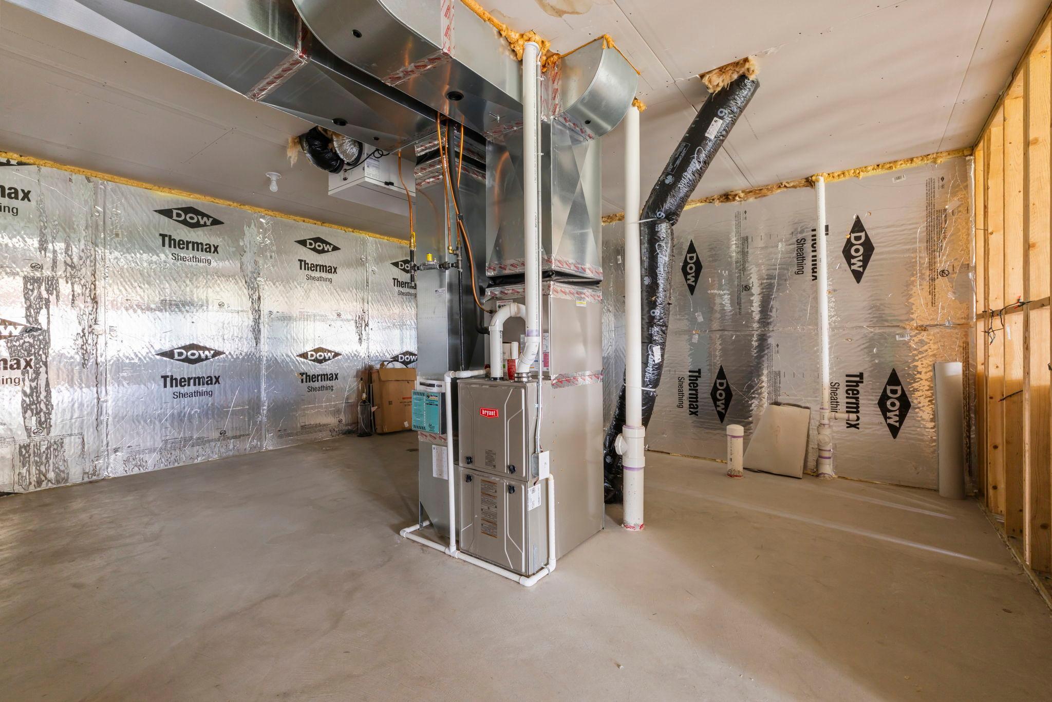Utilities area with rough in for additional bath