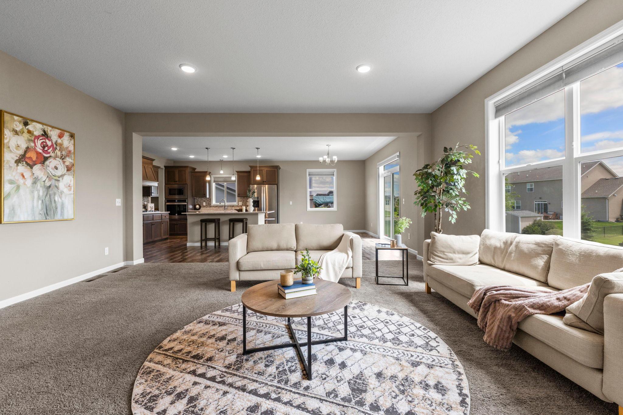 Living Room view into Kitchen and formal Dining room