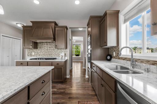 Kitchen view of gas range and island cabinetry