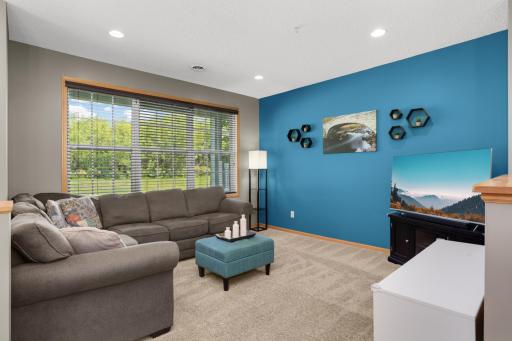 Generously sized living room features huge windows and great light. Open to kitchen and dining spaces for easy entertaining and flow