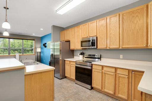 Kitchen features slow close cabinets, updated lighting, and a newer stainless steel appliance suite (2023)