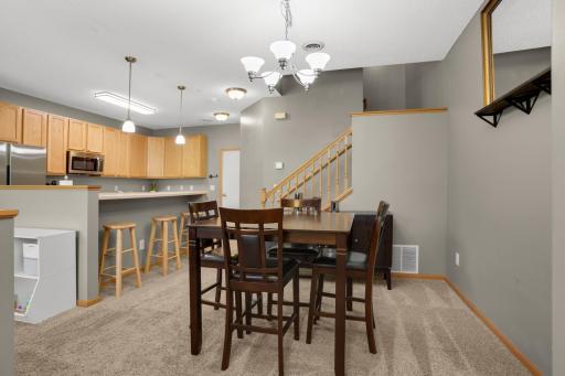 Main floor dining space can easily accommodate a group, plus additional countertop seating options