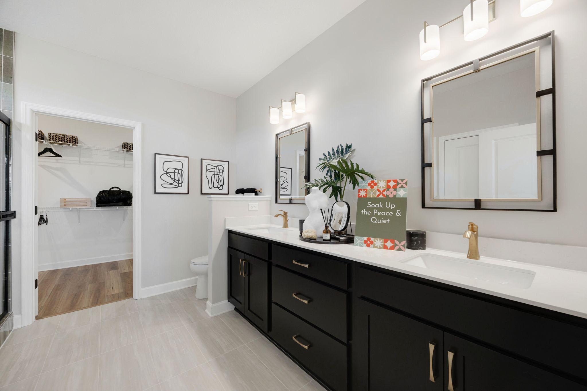 The owner's bath is huge and features dual sinks, linen closet, tiled shower and walk-in closet!