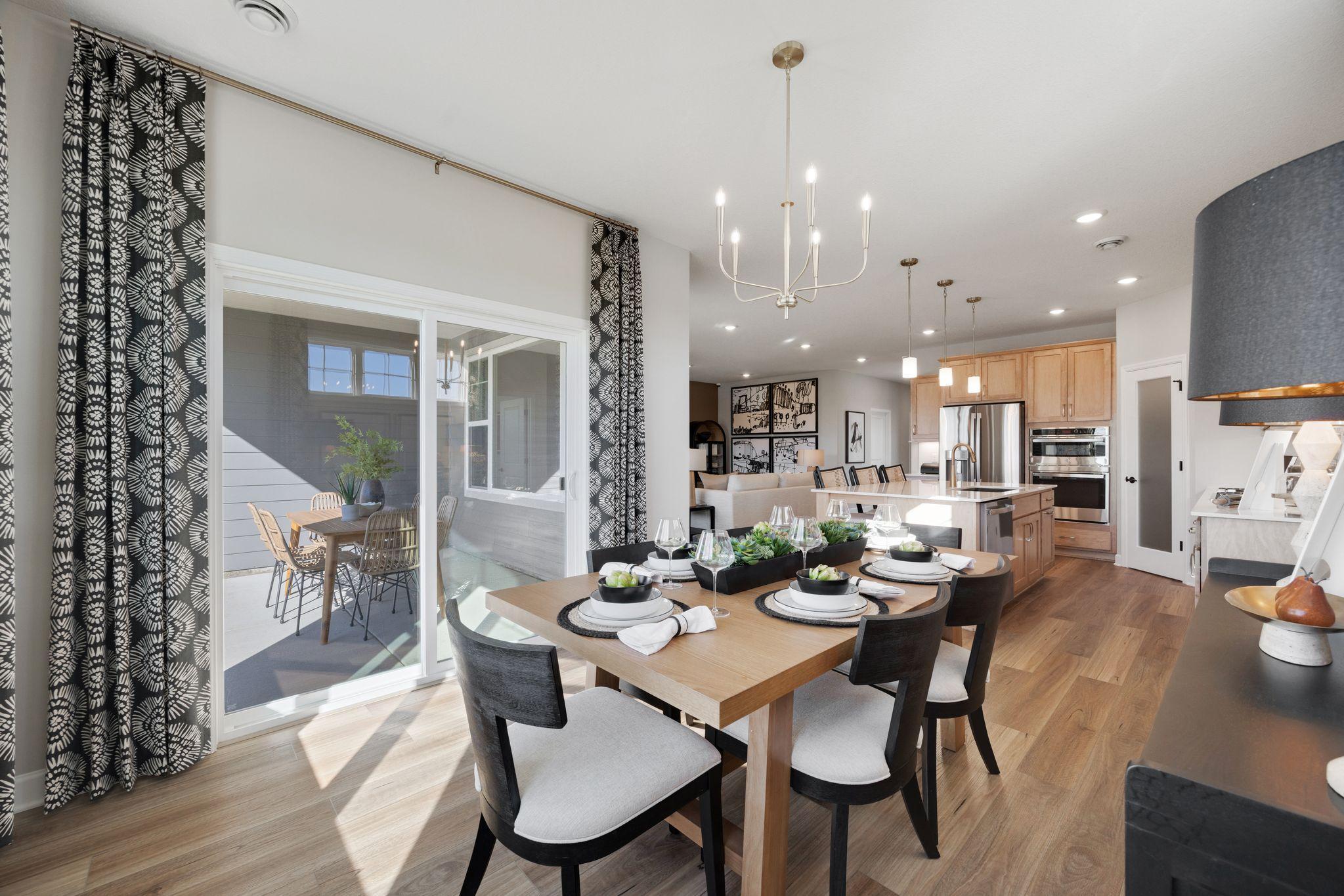 Covered patio is the perfect spot to enjoy meals outside and take in the pond views!