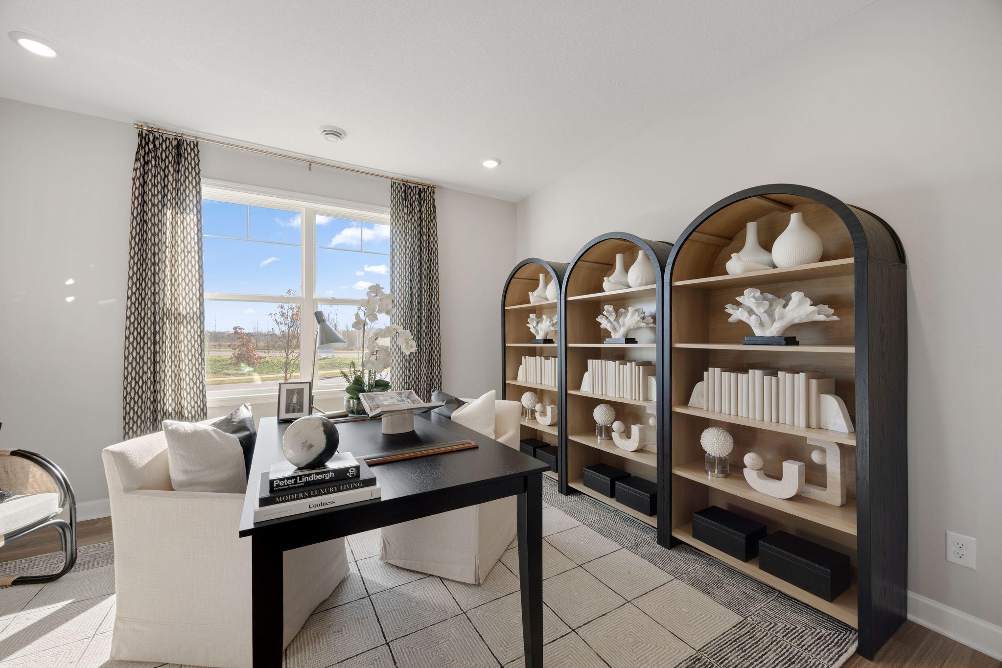 Another secondary bedroom, staged here as an office.