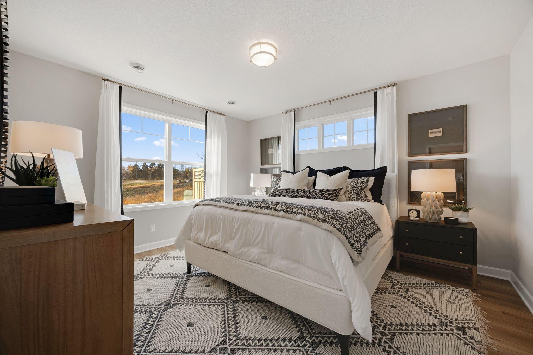The spacious owner's suite is off the family room, complete with private bath and walk-in closet.