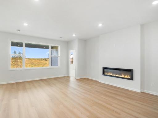Family room with large picture window to backyard, complete with pond views!