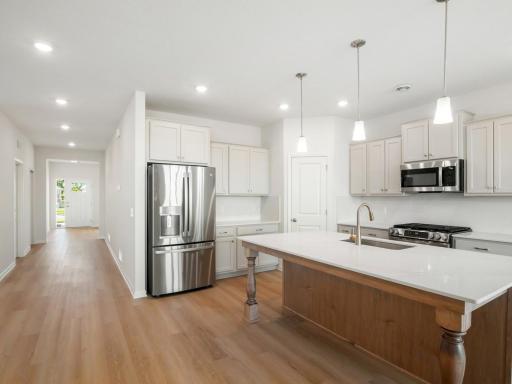 Kitchen features a corner pantry perfect for storing appliances and essentials.