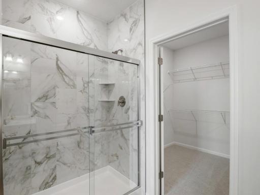 Beautiful tiled shower and spacious walk-in closet!