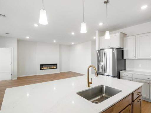 Open concept kitchen, dining and living area make the home feel bright and airy. Perfect for entertaining.