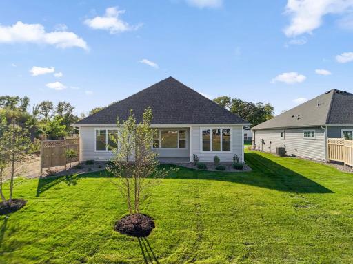 Spacious lot with pond views and a privacy fence.
