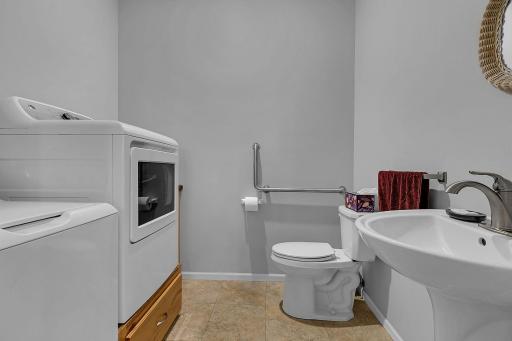 Main floor half bath and laundry.
