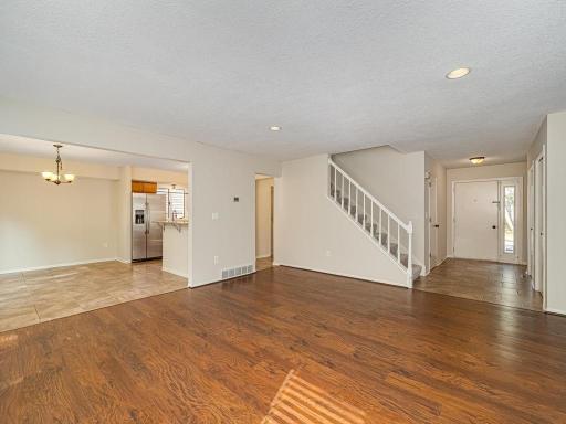 Informal dining opening up to the living room, Wood Flooring, Recessed Lighting