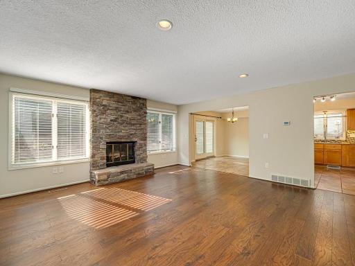 Open Living room with Wood burning fireplace and tons of natural light
