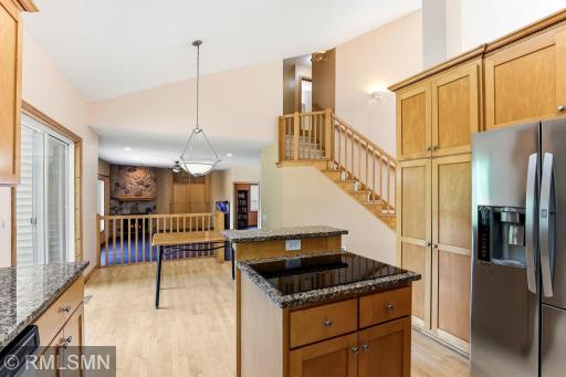 Flat Surface cooktop overlooks the informal breakfast table.