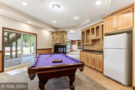 Large Wet Bar with Cabinetry and Fridge
