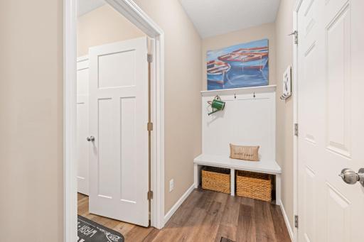 Mud room with custom built-in located at the garage entrance and just off the laundry room