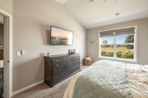 Primary bedroom with backyard views