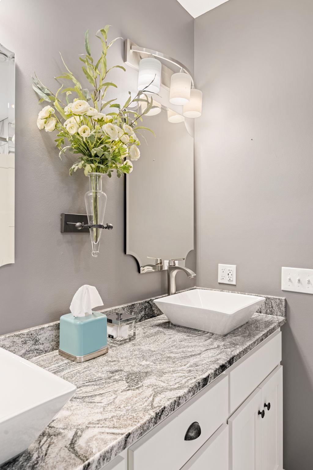 Primary Bathroom with Granite Countertops, New Mirrors and New Lighting